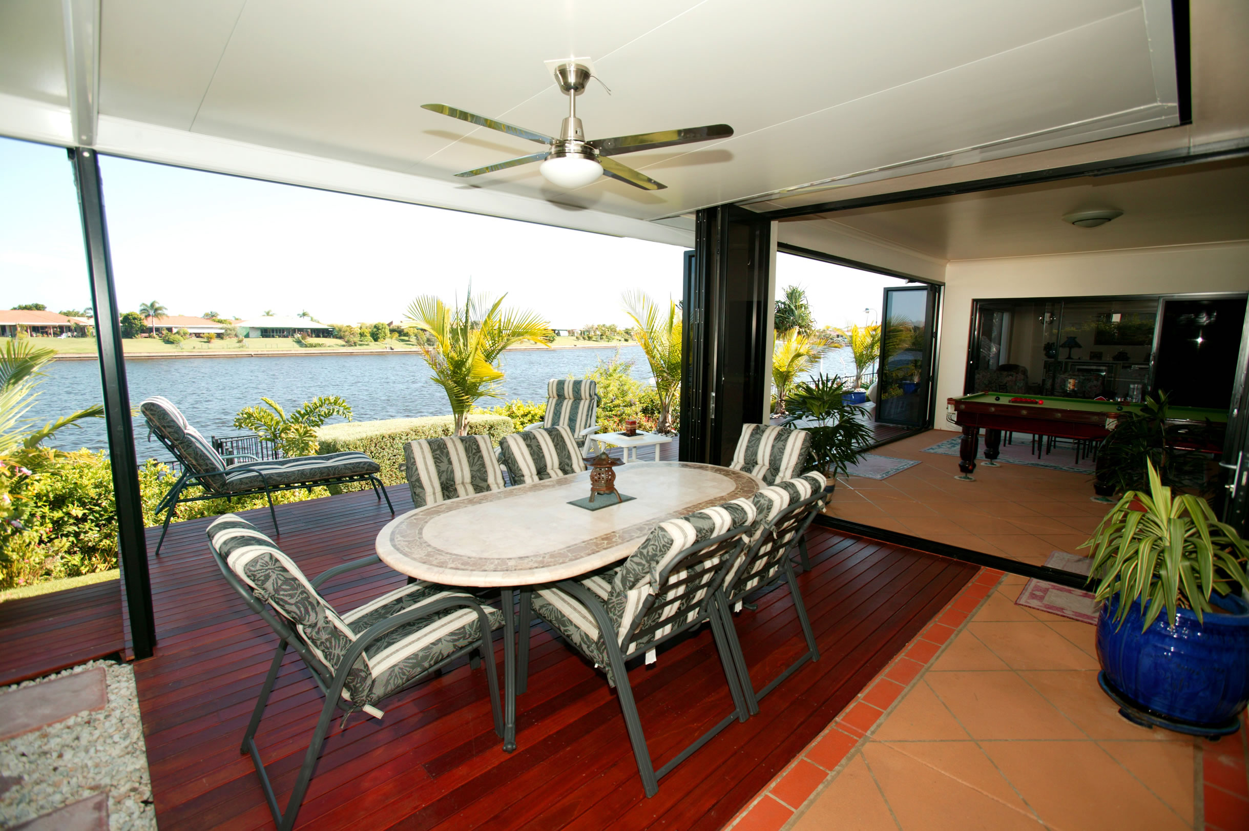 Coastal Patios insulated over timber deck on waterway with fan and light