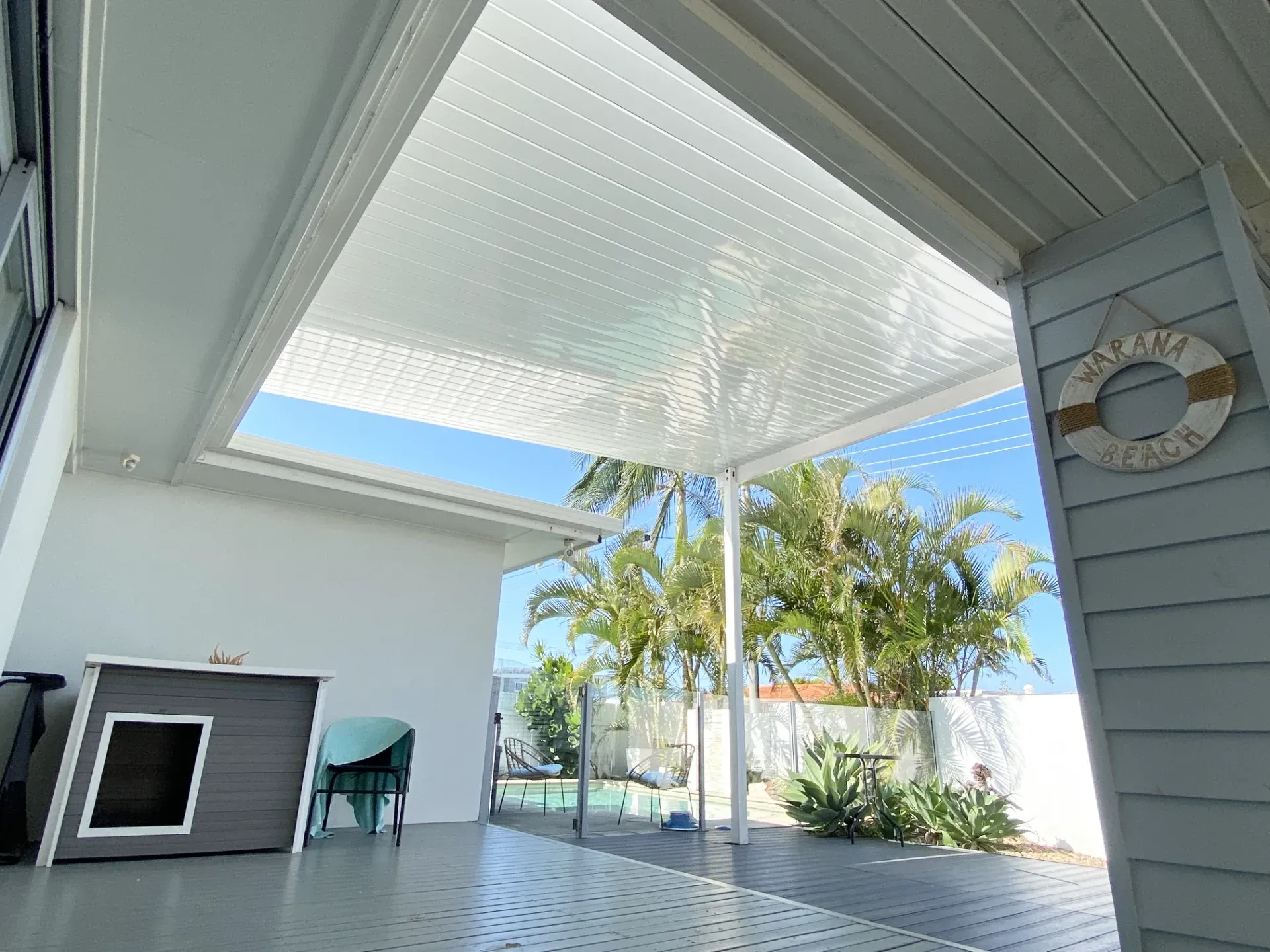 Flyover patio with a raised roofline over an outdoor living area