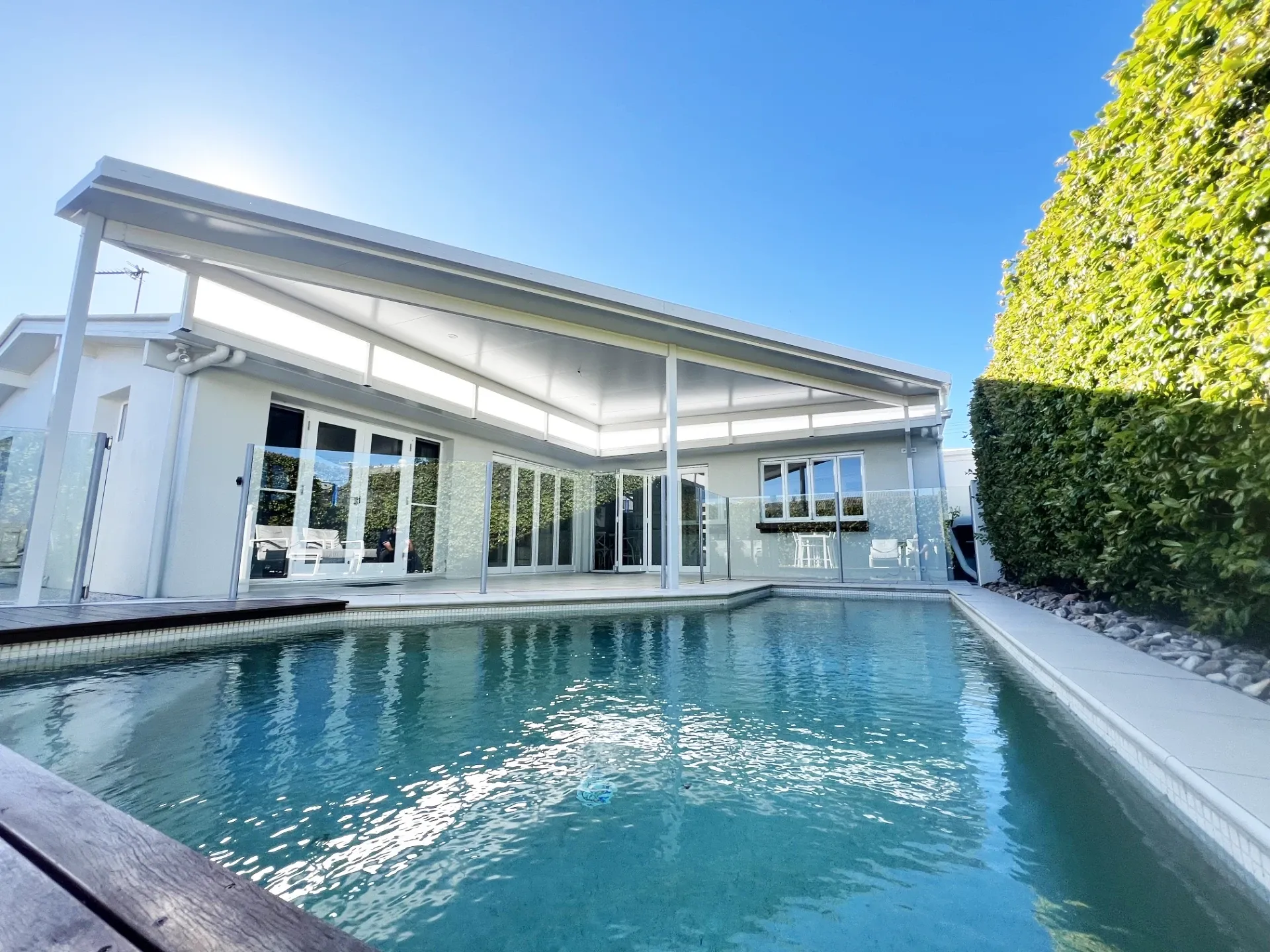 Box gutter flyover patio attached to a Sunshine Coast home