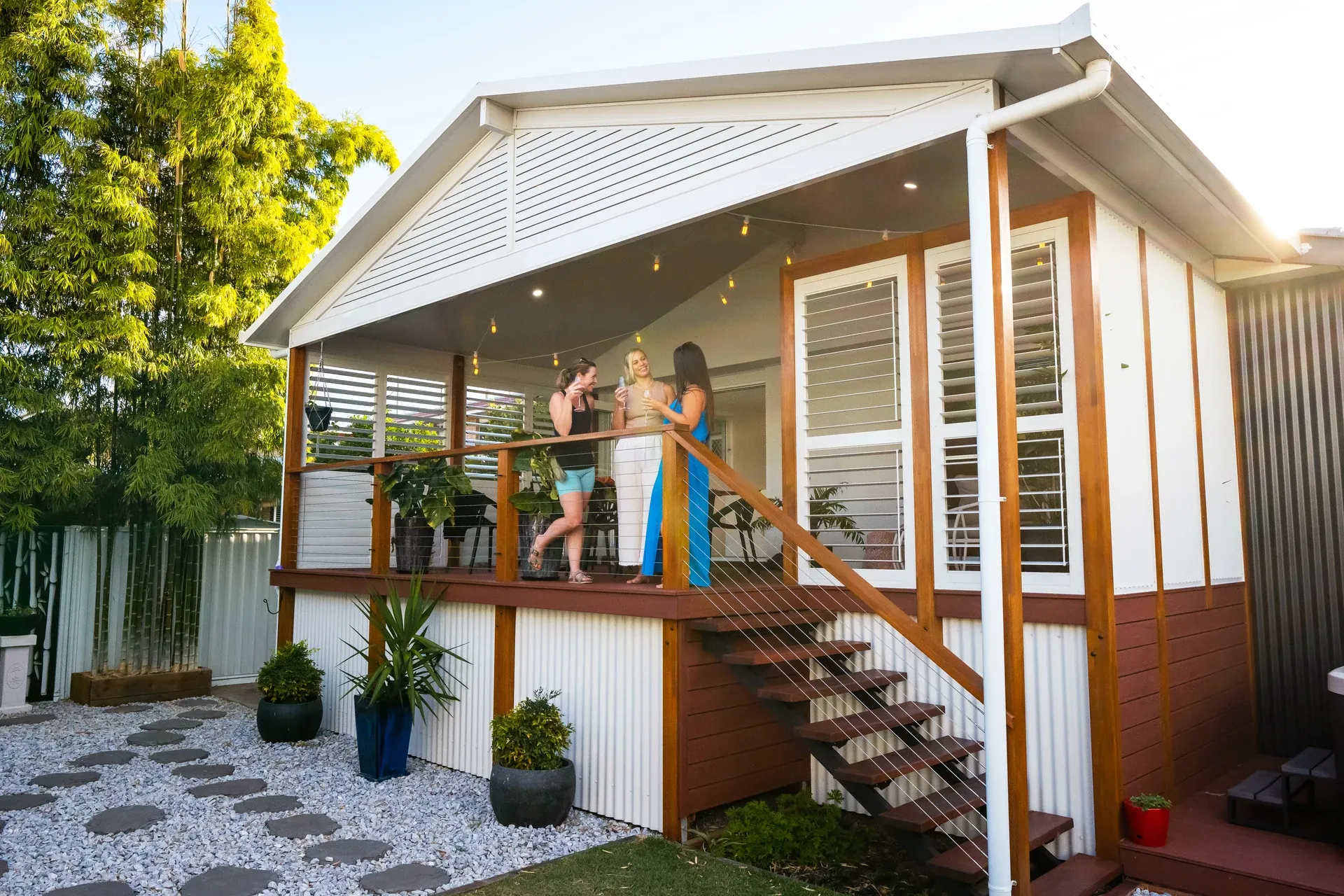 Gable patio with a pitched roof over a paved outdoor area