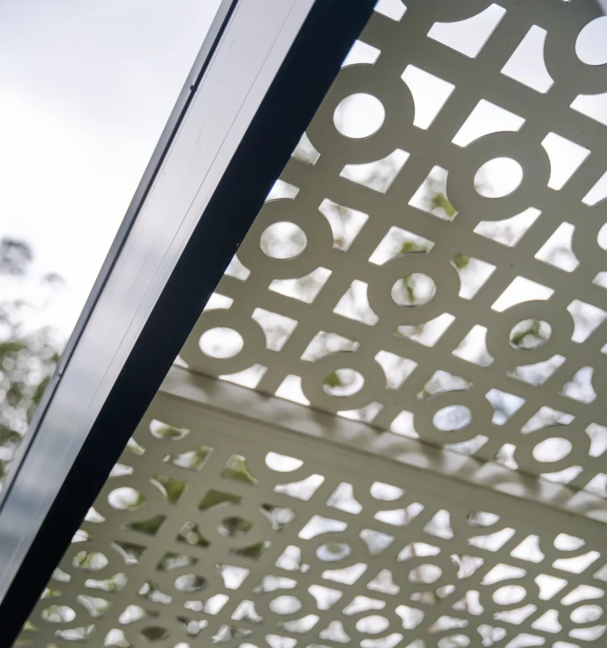 Aluminium shutters and privacy screens finishing an outdoor area