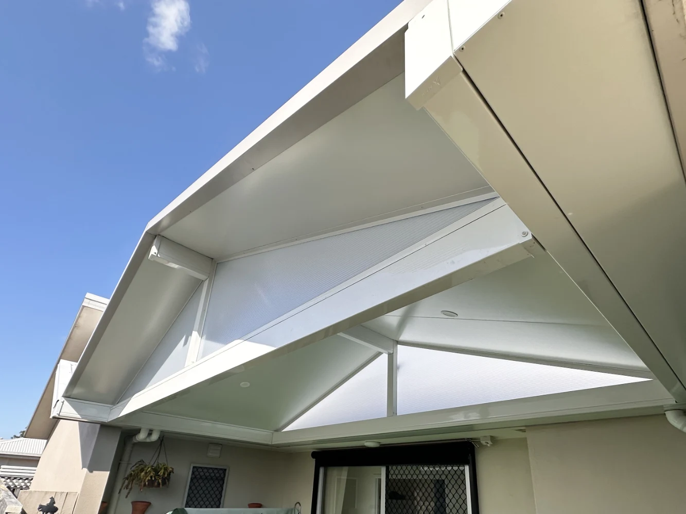 Gable patio roof fitted with skylights and vents