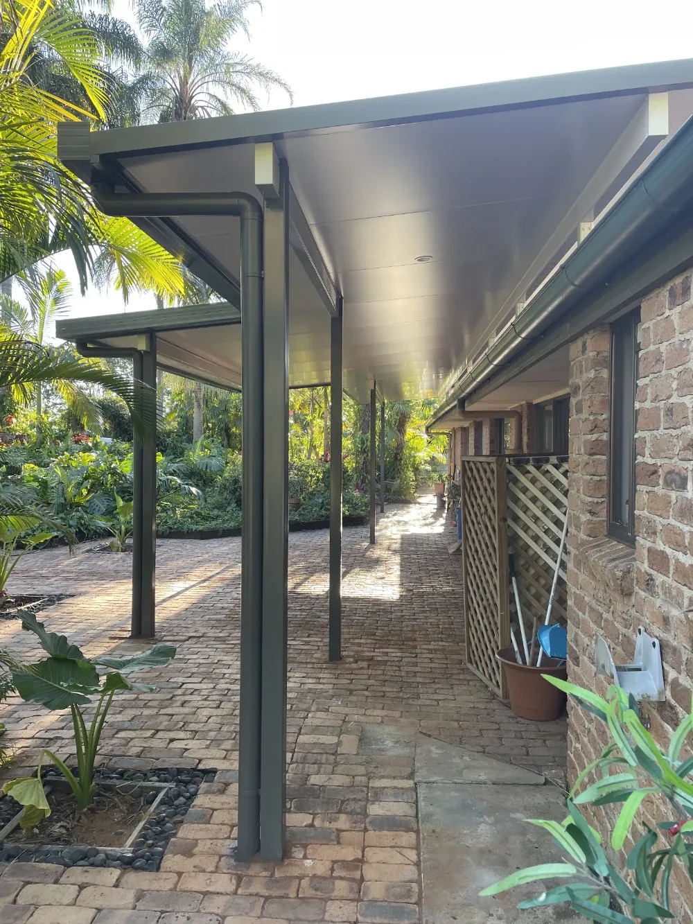 Patio roof in a grey green finish with an off white ceiling lining